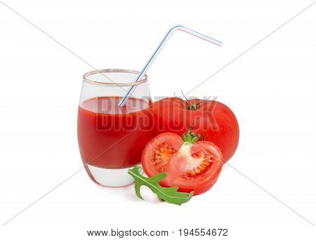 Tomato juice in glass with bendable drinking straw one whole and one half of the fresh ripe tomatoes and arugula leaf on a light background