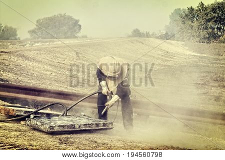 Sandblasting of metal structures at construction site