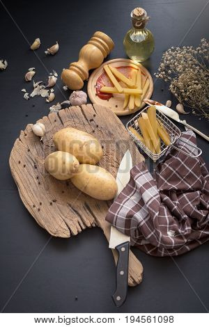 Deep Fried Potato Slice And Potato On Wooden Baord For Cooking