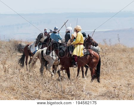 Tiberias Israel July 01 2017 : Participants in the reconstruction of Horns of Hattin battle in 1187 participate in the battle on horseback on the battlefield near Tiberias Israel