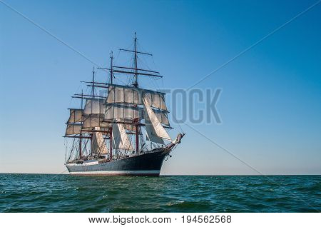 Clear sky, sunny afternoon , Four-masted barque three-quarters view