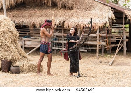 Asian beautiful girl are happy playing Pong Lang is a Thai musical instrument in summer at Countryside.