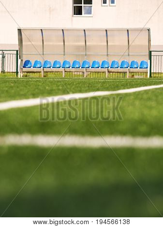 New Blue Plastic Seats On Outdoor Stadium Players Bench, Chairs Under Transparent Plastic Roof
