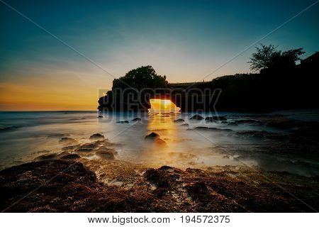 Beautiful Sunset Inside Rock Hole And Scenic Seascape At Tanah Lot Temple Indonesia