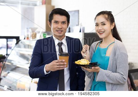 Asian People Man And Woman Standing Front Of Cafe With Smiling Together. People With Customers At Ca