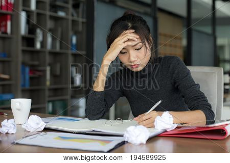 Asian woman working with serious situation at office woman with stressful concept 20-30 years old.