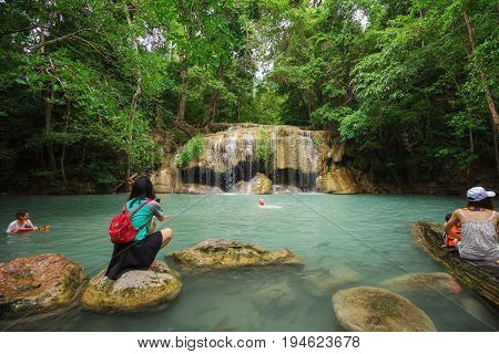 People Traveling And Bath In Erawan Waterfall, Thailand
