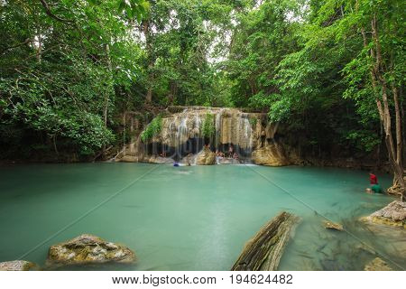 People Traveling And Bath In Erawan Waterfall, Thailand