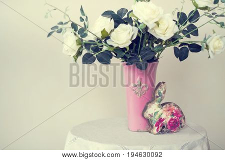 Rose placed on the desk in blue background