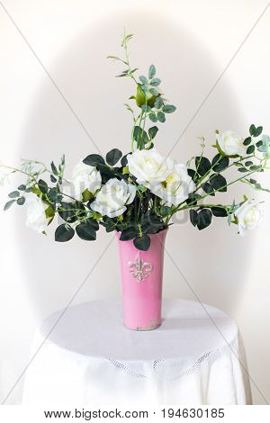 Rose placed on the desk in blue background