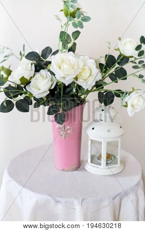 Rose placed on the desk in blue background