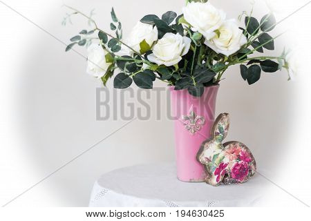 Rose placed on the desk in blue background