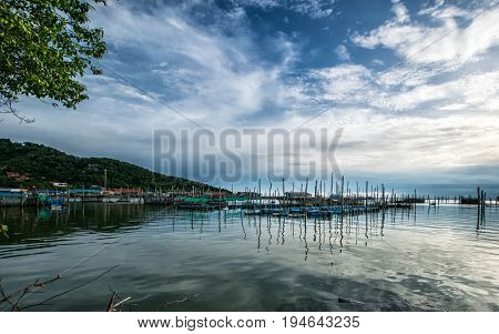 Homestay and floating basket in lake at Kohyo Songkhla Thailand with beautiful sky and clouds. This is traditional fisheries area.