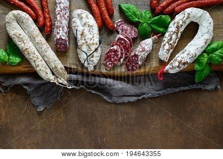 Artisan salami on a rustic board view from above flat lay space for atext