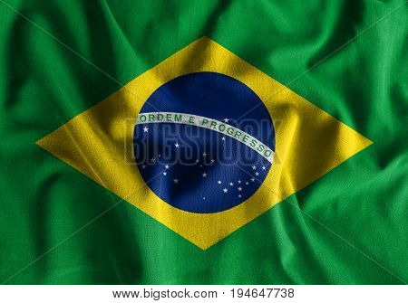 Brazil flag painting on high detail of wave cotton fabrics . 3D illustration .