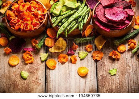 Dried vegetables chips from carrot, beet, parsnip and other vegetables . Organic diet and vegan food.