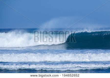 Wave breaking in the sea with foam on top