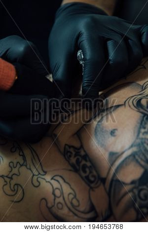 Tattoo Artist Drawing Art On Body