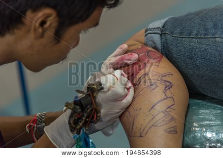Tattoo Artist Drawing Art On Body