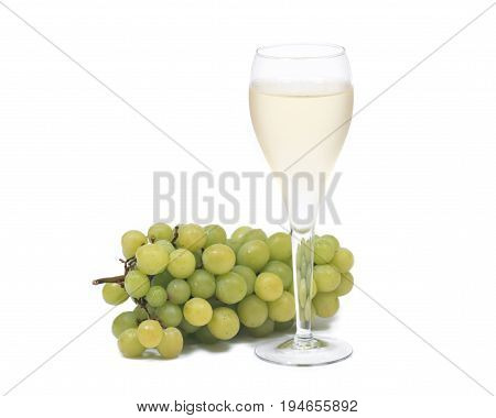Glass of white wine and ripe organic green grapes isolated on white background