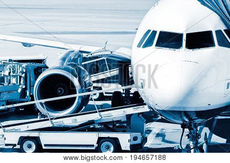 Commercial jet at the gate going through pre-flight preparations.