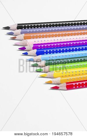 12 colorful paint pens on white background
