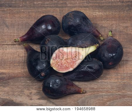 Fresh ripe organic figs on vintage wooden tray