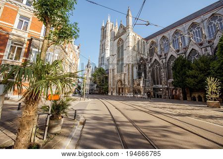 Street view with saint Bavo cathedral during the morning light in Gent city, Belgium