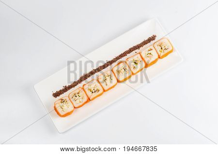Dessert Maki Sushi - Roll With Various Fruit In Rice Pudding And Coconut Flakes