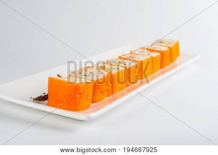 Dessert Maki Sushi - Roll With Various Fruit In Rice Pudding And Coconut Flakes