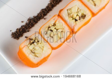 Dessert Maki Sushi - Roll With Various Fruit In Rice Pudding And Coconut Flakes