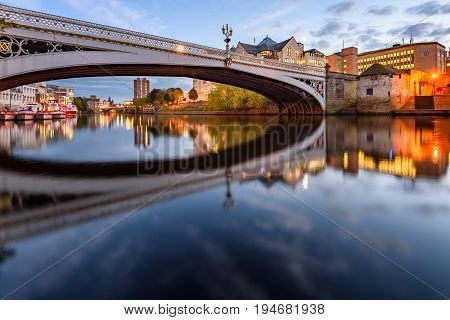 Famous bridge and River Ouse with reflections in York UK