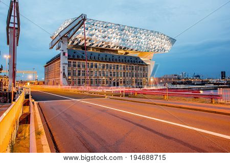 ANTWERPEN, BELGIUM - June 02, 2017: Night view on the illuminated Port House building designed by Zaha Hadid architect in 2009 in Antwerpen city, Belgium