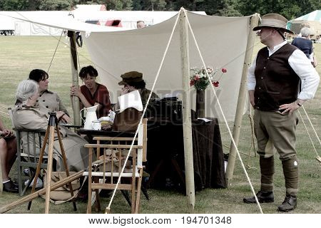 Sandhurst, Uk - 18Th June 2017: Vintage Toned Shot Of Enthusiasts In Ww2 Period Costume At A Militar