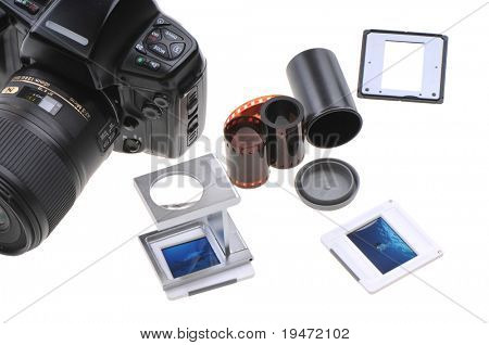 Old timer slide photographerÃÂ¢Ã?Ã?s lightbox including film, loupe, frames and box. White background studio image.