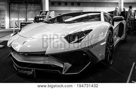STUTTGART GERMANY - MARCH 17 2016: Mid-engined sports car Lamborghini Aventador LP 750-4 SuperVeloce 2016. Black and white. Europe's greatest classic car exhibition 