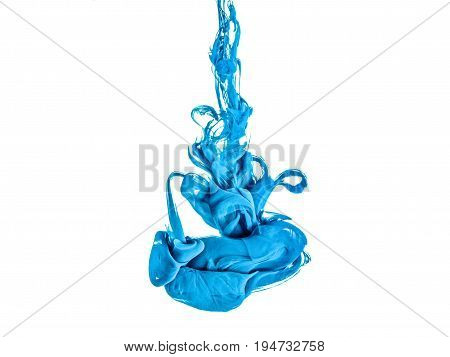 Ink swirl in a water, isolated on white background. The blue paint in the water. Soft dissemination a droplets of colored ink in water close-up. Explosion of color splashes acrylic ink.