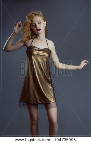 Shapely girl with a luxurious hair and closed eyes