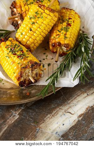 Corn Grilled With Salt And Spices. Dark Background. Fast Food In