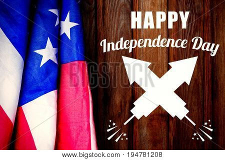 Digitally composite image of Happy Independence Day text against wood