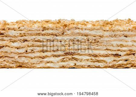 Napoleon cake texture on white background. Puff pastry butter-custard
