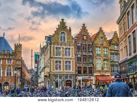 Bicycles On Markt And People Walking Along Steenstraat. View Towards Hallestraat. Bruges, Belgium