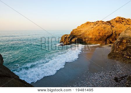 Beach on Mediterranean sea coast in Nerja, Spain