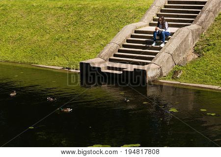 St. Petersburg Russia - June 28 2017: girl on the stairs near the water in Peterhof in St. Petersburg