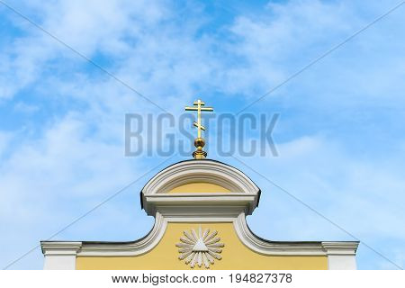 Dome and cross against the blue sky