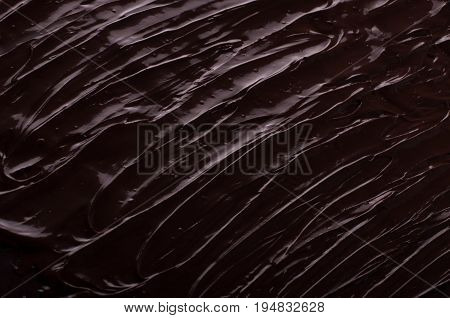Chocolate background waves cooking concept - melted chocolate as a background