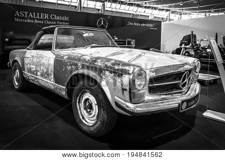 STUTTGART GERMANY - MARCH 18 2016: Prepared for the restoration of sports car Mercedes-Benz 230 SL Pagode (W113) 1968. Black and white. Europe's greatest classic car exhibition 