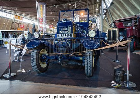 STUTTGART GERMANY - MARCH 18 2016: The tractor Lanz Bulldog D2531 (two-stroke hot bulb engine) manufactured by Heinrich Lanz AG in Mannheim 1939. Europe's greatest classic car exhibition 