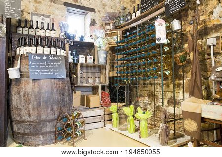 Valognes Normandy France - February 06 2014. Traditional typical delicatessen shop in Normandy. Shop of jams chutney alcohol biscuits pasta beer milk jam and retro products for decoration In wooden boxes