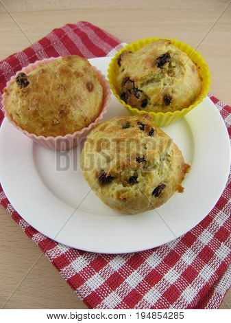 Fresh baked spelt muffins with dried grapes
